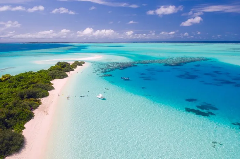 Copie a Copie a Copie a Early tourists choices to the sea of Maldives in fancy dresses and suits